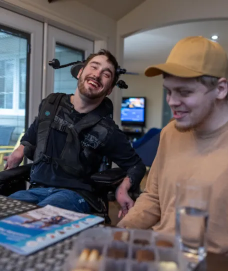 Two people at dining table