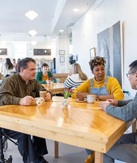 3 people dining at a table