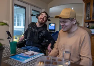 Two people at dining table
