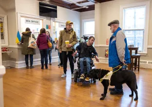 Person in wheelchair with dog