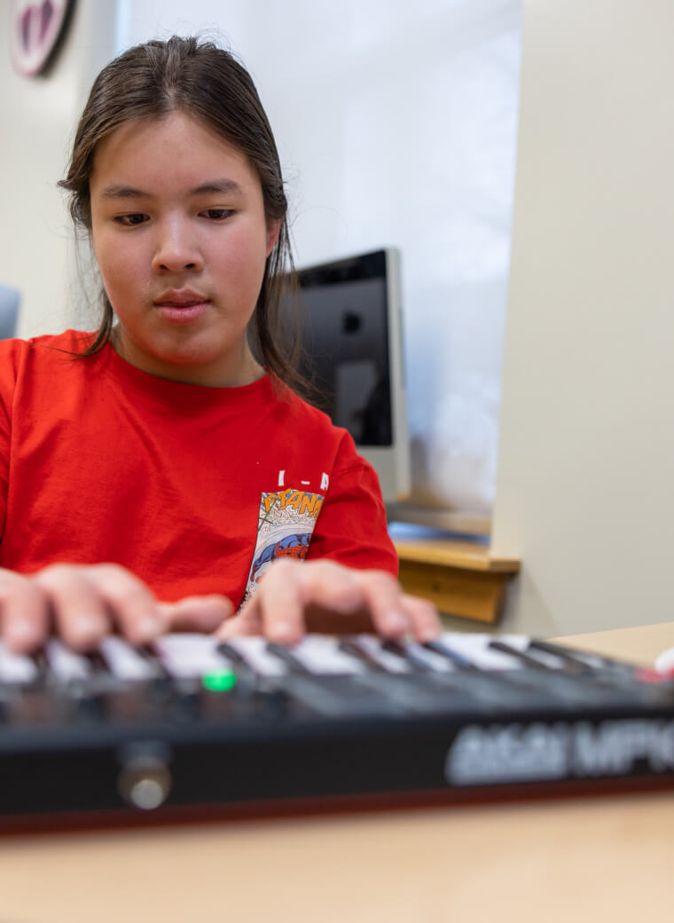Girl playing keyboard