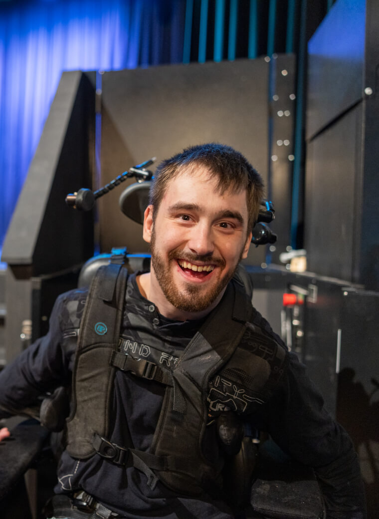 Man in suit with black straps