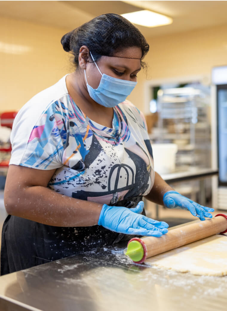 Woman rolling dough